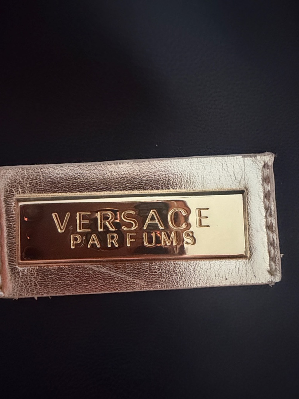 Versace Parfums black and Gold Logo Plaque Tag